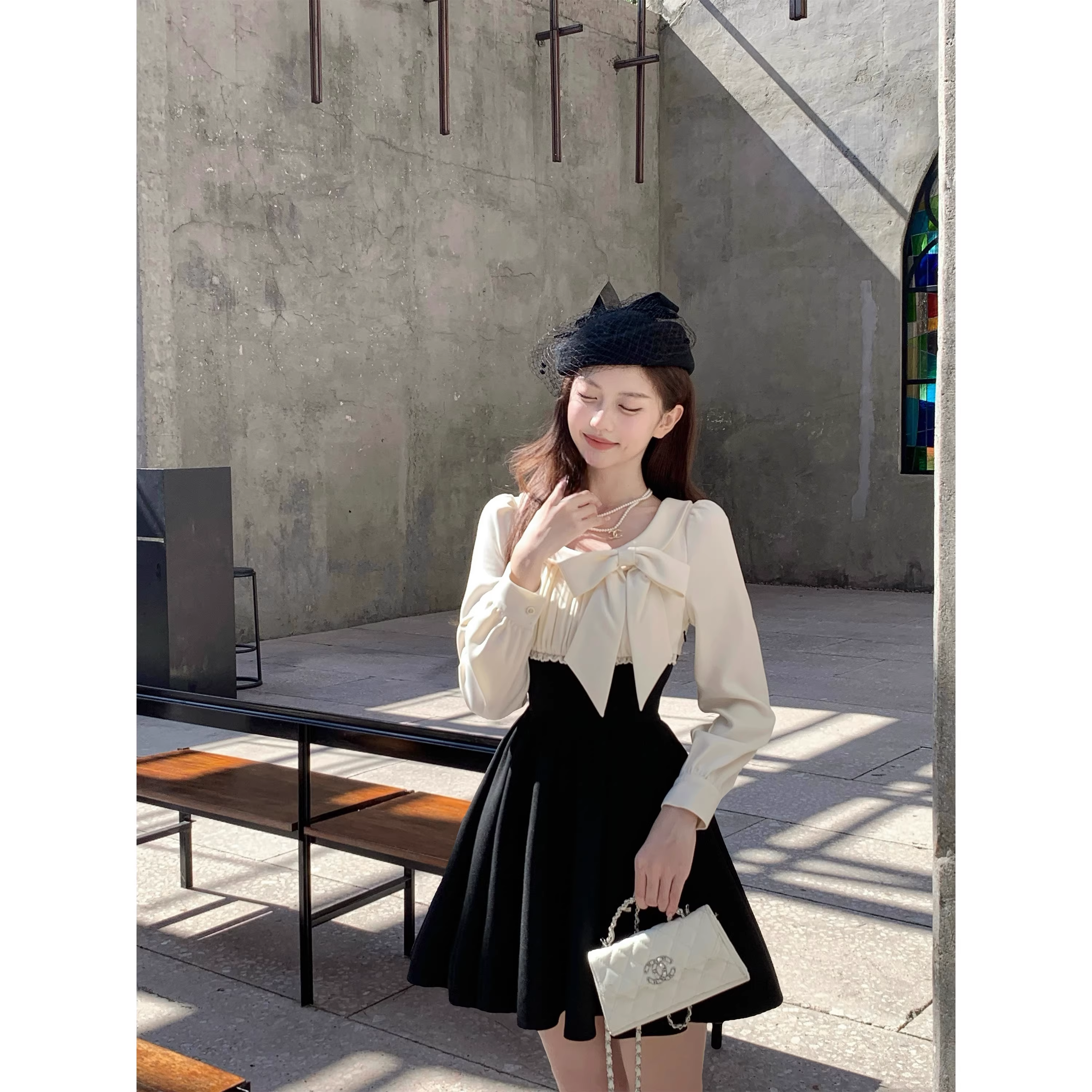 Black dress with a fitted waist, short skirt, and long sleeves A42 - VelvetHem