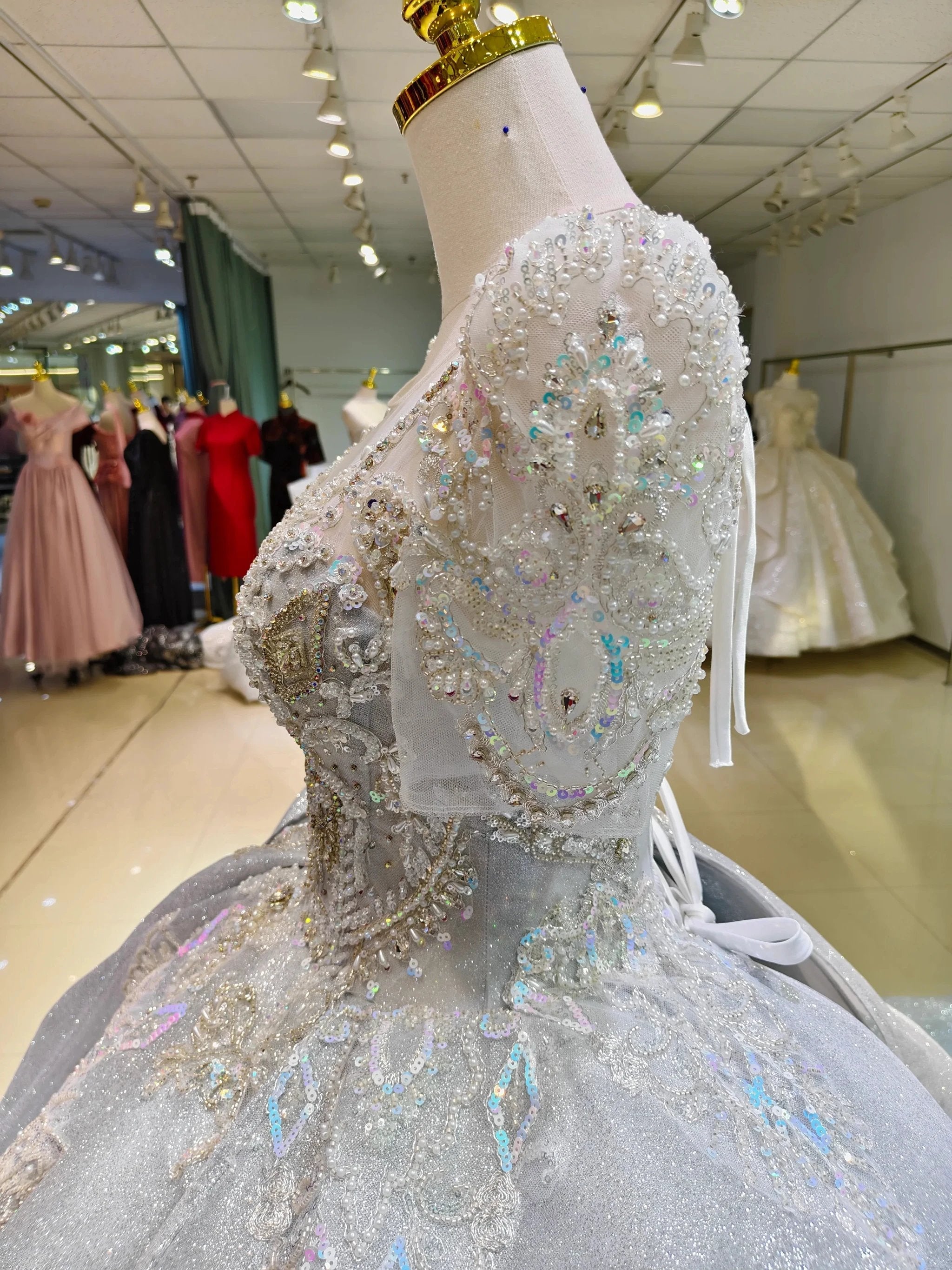 Silver Glimmer V-Neck Ballgown: Crystal-Embroidered Bust & Dramatic Bow Train (ZD16773)