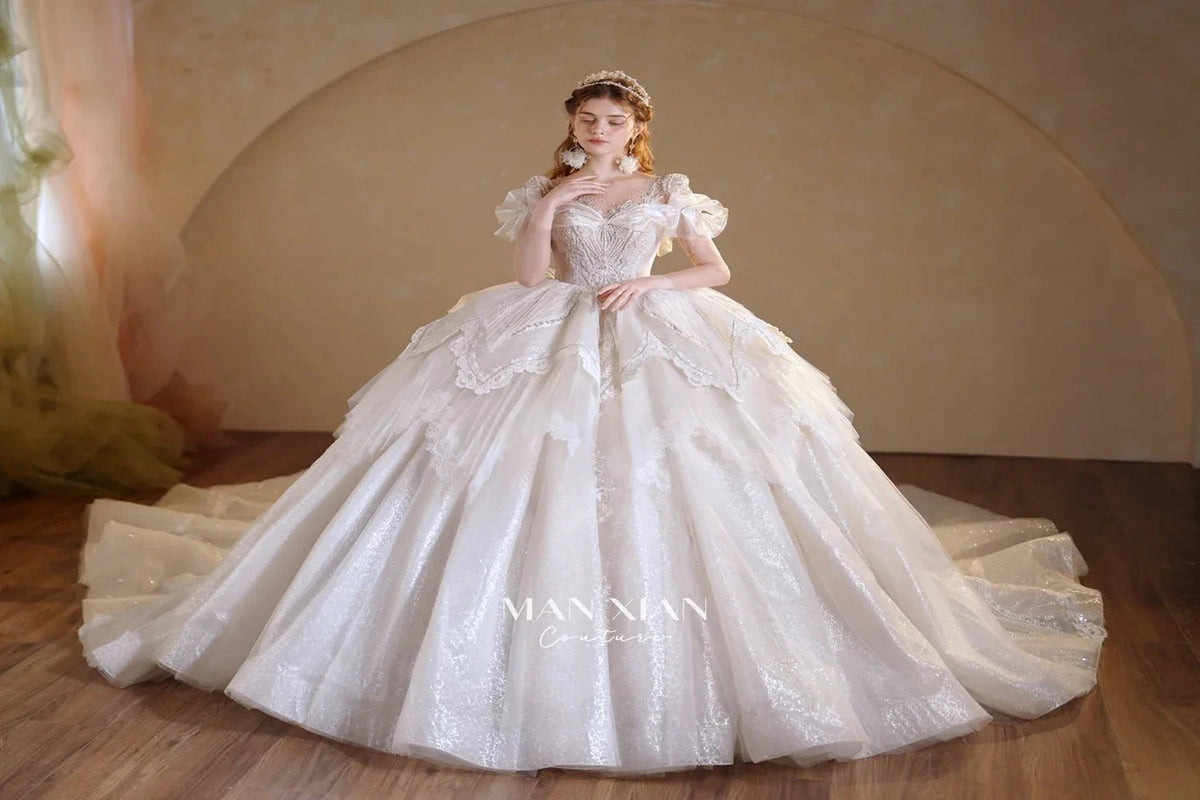 Luminous Ivory Sweetheart Glitter Tulle Ball Gown with Ruffled Sleeves, Pearl Embroidery & Lace Train (ZD16939)