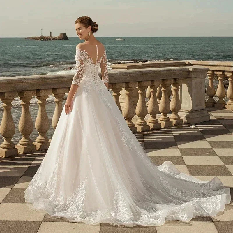 MACDUGAL Exquisite Three-Quarter Sleeves Mopping O-Neck Lace Charming Applique Back Lace Double Button Wedding Dress (ZD14268)