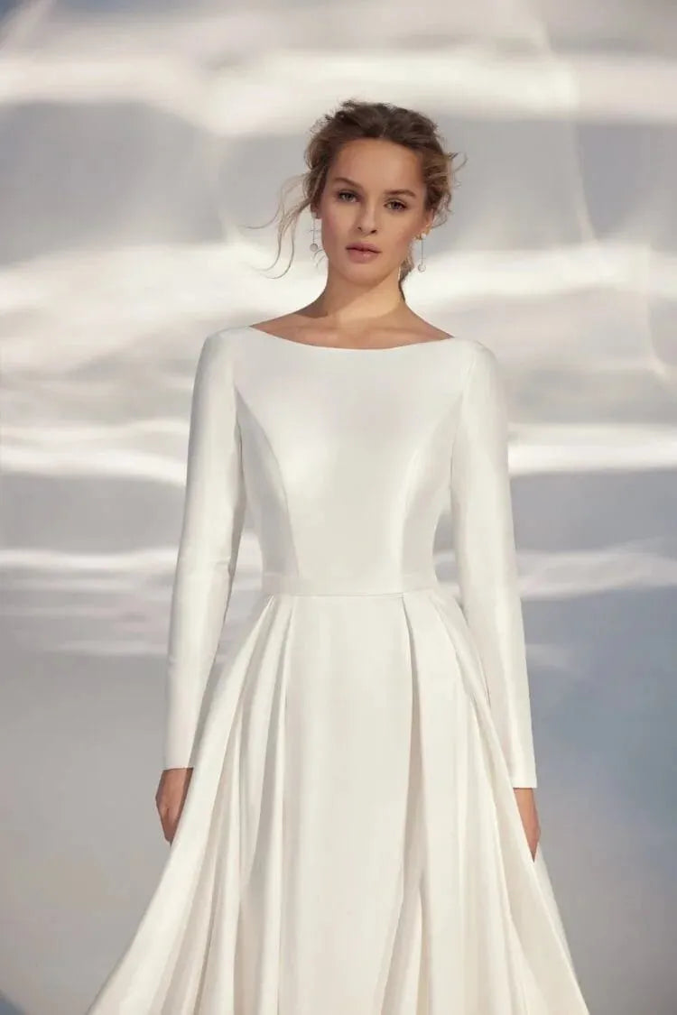 Elegant A-Line Wedding Gown with Long Sleeves, High Neckline, and a Flattering Natural Waistline – Minimalist Bridal Dress